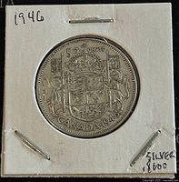 Reverse side showing Canadian coat of arms, 50 cents denomination, and year 1946