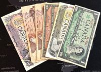 Front view of Canadian paper banknotes from various years ranging from 1954 to 1986.