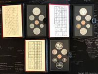 Three Canadian proof coin sets displayed with coin types and holder covers.