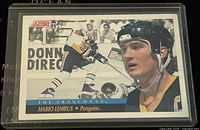 Front of 1991 Score Mario Lemieux Penguins trading card, showing action and portrait images with 'The Franchise' branding.