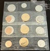 Photo of one full Canadian coin set in sealed plastic including penny, nickel, dime, quarter, half dollar, dollar, and two dollar coins.