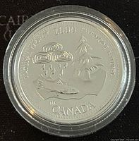 Reverse side of the silver proof coin showing Natural Legacy design with fish, tree, and clouds, including the year 2000 and Canadian origin.