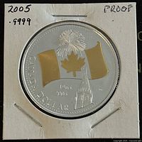 Obverse side showing the commemorative design with Canadian flag gold plating and inscriptions.
