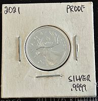 Front side showing caribou design, 'CANADA', '25 CENTS', '.9999 SILVER',' and proof condition writing on holder