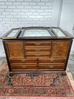 Front view of the Broyhill chest of drawers with mirrored top and multiple drawers and cubbies visible. The mirrored glass top panels are on the top surface.