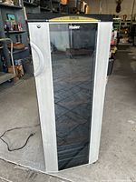 Haier wine cooler upright showing glass door with silver side panels and top control panel