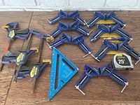 Photo showing all items including three corner clamps, three quick grip clamps, blue speed square, and tape measure