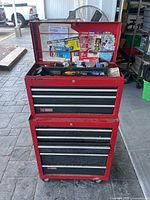 Full view of red Craftsman top chest stacked on rolling bottom cabinet with lid open