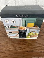 Box of Rae Dunn Bullet Blender showing front with product image, power (600W), capacity (24 oz), six-tip stainless steel blade, and leak-proof lid features