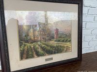 Full view of framed print showing the artwork and frame condition including spotting on matting and glass reflections.
