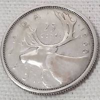 Close-up of the 1960 Canadian 25 cent coin showing the caribou design on the reverse side.