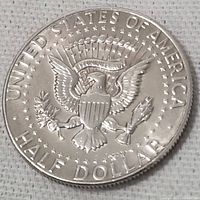 Full reverse view of the 1969 USA half dollar coin showing the eagle and inscriptions