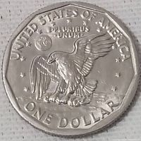 Close-up of the 1979 USA one dollar coin showing the eagle design and inscriptions.