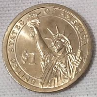 Close-up image of the obverse side of a 2011 United States $1 coin showing the Statue of Liberty design and inscriptions.