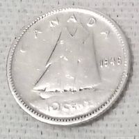 Obverse side of the 1957 Canadian 10 cent coin showing Bluenose schooner and year '1957'.