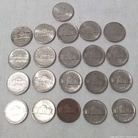 Photo showing all 25 US 5 cent coins arranged in rows displaying reverse side with Jefferson Memorial design.