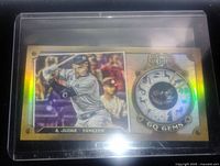Gold holofoil baseball card featuring A. Judge of the New York Yankees in batting stance, with zodiac/gem symbol on right side, protected in clear plastic sleeve.