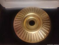 Top view showing the carbide teeth arranged in circular patterns on the disk surface.