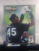 Front view of Michael Jordan baseball card, showing him in Chicago White Sox uniform with '45' jersey number, batting with gloves, Collector's Choice logo, and Rookie Class patch.