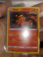Front view of the Tepig Holo Single Strike Pokémon card showing artwork, stats, and moves.
