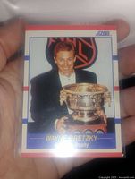 Photo of Wayne Gretzky Art Ross Trophy hockey card in protective sleeve.