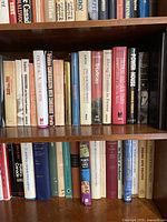 Bookshelves filled with used Canadian political books, showing titles and spines.