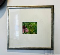 Framed watercolour painting of floral scene with pink flowers and greenery, showing entire piece and frame.