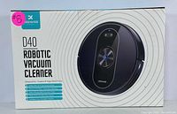 Box front showing product name and features including Wi-Fi, voice control, carpet and hard floor use.