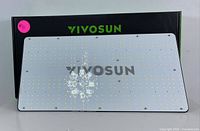 Front side view of rectangular LED grow light panel with numerous LEDs covered by clear surface and 'VIVOSUN' in green on black panel top edge.