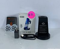 Front view of charging stand, charger, cable, adhesive rings, and CW350 product box with pink lot sticker