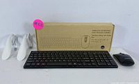 Wireless keyboard and mouse set with box and two USB laptop lights on white background