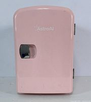 Front view of the pink AstroAI mini fridge showing the brand logo and door handle.