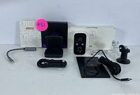 Two wireless streaming cameras with their mounting hardware, power cables, and a Benfei USB adapter.