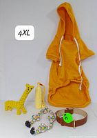 Front view of 4XL orange pet hoodie with hood and drawstrings, four dog toys and brown leather collar with buckle.
