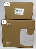 Two sealed cardboard boxes, bottom box labeled Furomate PCT110 self-cleaning cat litter box, top box labeled cat litter ramp