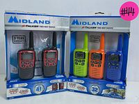 Two sets of Midland X-Talker radios in original packaging; one pair in black and one trio in multi-colors (blue, orange, green).