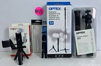 Full kit laid out showing all included camera supports and tripods with boxes and packaging.