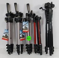 Five tripods arranged side by side showing variety in color and style including Soligor T175