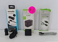 Photo showing three Digipower items: USB car charger kit, 33W USB wall charger, and braided USB-C charging cable in packaging