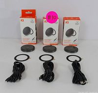 Three magnetic wireless chargers with built-in kickstands, each with a circular adhesive ring and USB-C cable, displayed with retail packaging boxes labeled 'iQ'