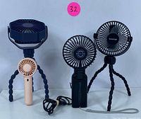 Front view of three USB rechargeable portable fans with flexible tripod legs and clip-on mount, showing different sizes and colors