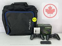 Black PS4 Pro carrying case with blue trim and 'FOR PS4 pro' branding, shown with accessories in front including controllers and a charging dock box.