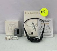 Both the G5 Air Conduction Wireless Stereo Headset with its box and user manual and the Jmstarbg True Wireless Earbuds with charging case and cable shown together.