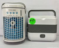 Front view of the TIPTOP HOME portable air cooler and the electric lunch box placed side by side showing controls, fan blades, and lunch box handle.