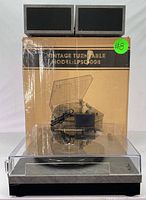 Vintage style Model LPSC008 turntable with clear dust cover and original box behind. AC power adapter in front of the turntable.