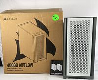 Corsair 4000D Airflow mid-tower PC case in box with manual, showing branding and model.