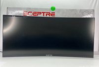Front-facing view of monitor powered off showing curved ultrawide screen and bottom-center Sceptre logo