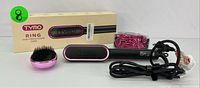 Front view of TYMO Ring Hair Straightening Comb with original box, detangling brush, and pink-black heat-resistant glove