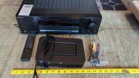 Sony receiver, remote, Bluesound Node 3, power cord and RCA cable with measuring tape