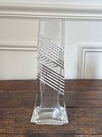 Front view of clear square crystal vase with diagonal etched stripe band.